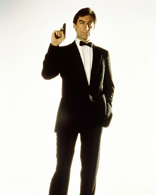 #ad Timothy Dalton suave in tuxedo holds up gun as Bond Living Daylights 8x10 photo $10.99
