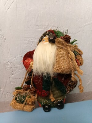 #ad Santa Carrying Christmas Items Figurine LL $8.00
