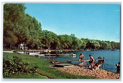 #ad c1950#x27;s On The Shores Of Scenic Fishing Dog Boats Gull Lake Michigan MI Postcard $29.95